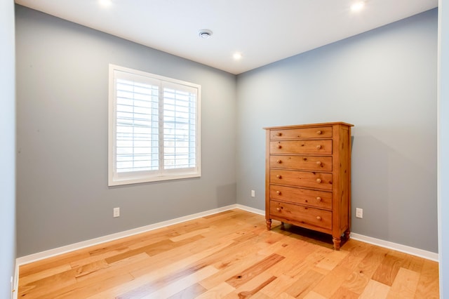 unfurnished room with light hardwood / wood-style flooring