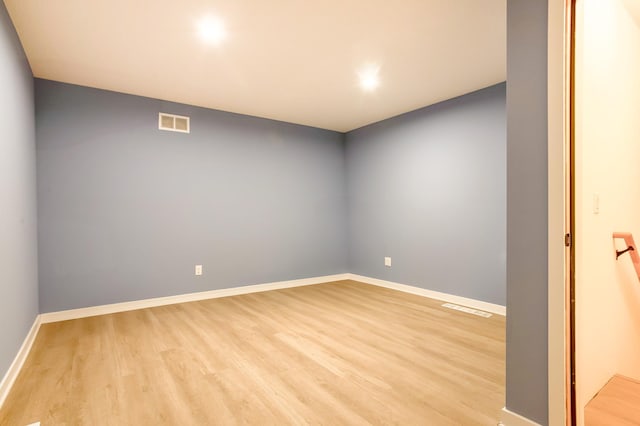 empty room with light hardwood / wood-style floors