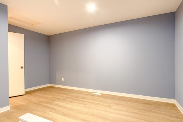 spare room with light hardwood / wood-style floors