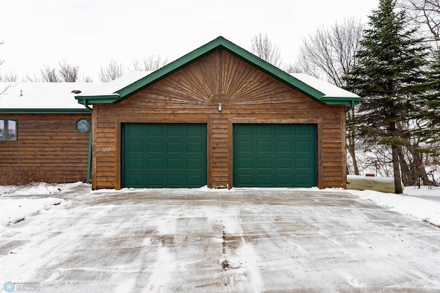 view of snow covered garage