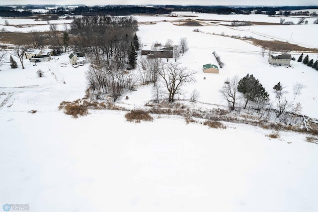 snowy aerial view featuring a rural view