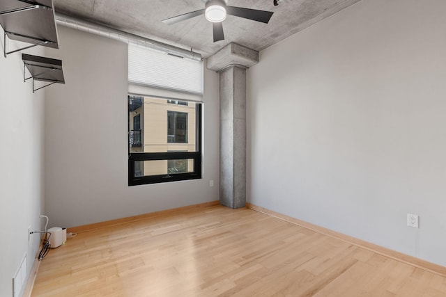 spare room with ceiling fan and light hardwood / wood-style floors