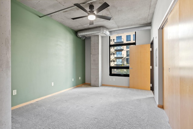 carpeted empty room with ceiling fan