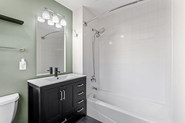 full bathroom featuring vanity, toilet, and washtub / shower combination