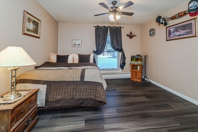 bedroom with ceiling fan and dark hardwood / wood-style floors