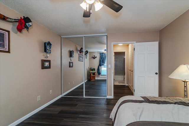 bedroom featuring a textured ceiling, dark hardwood / wood-style flooring, a closet, and ceiling fan