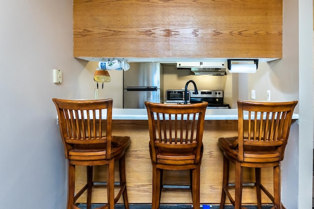2800 Hamline Ave N Unit 150, Roseville, MN 55113 - bar area with stainless steel appliances and under cabinet range hood