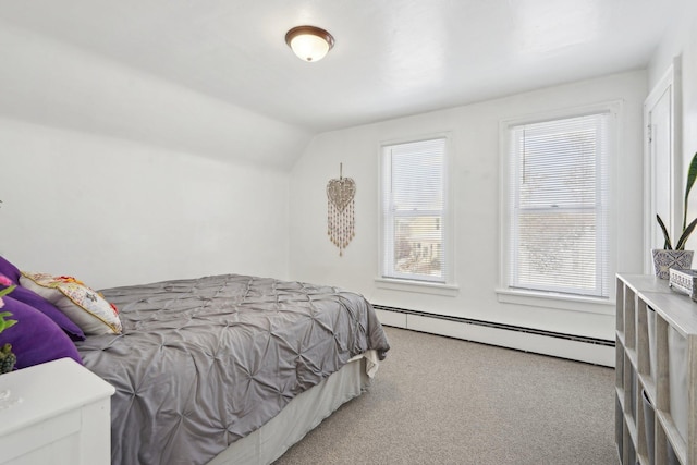 carpeted bedroom featuring a baseboard radiator, multiple windows, and lofted ceiling