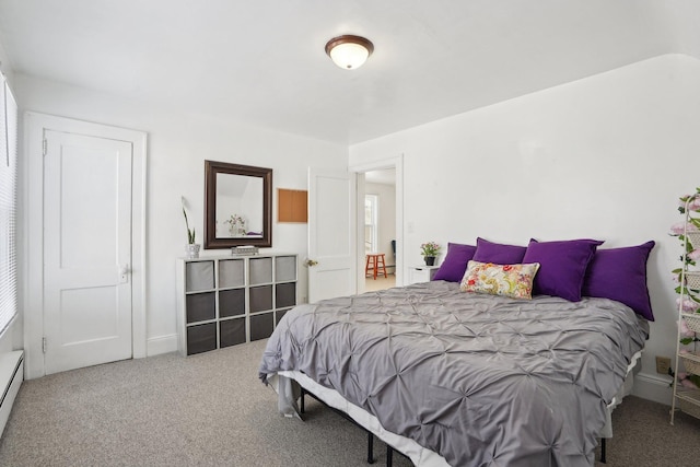 bedroom with carpet and a baseboard radiator