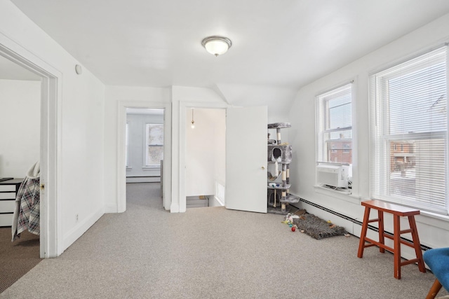 miscellaneous room featuring cooling unit, carpet flooring, and a baseboard radiator