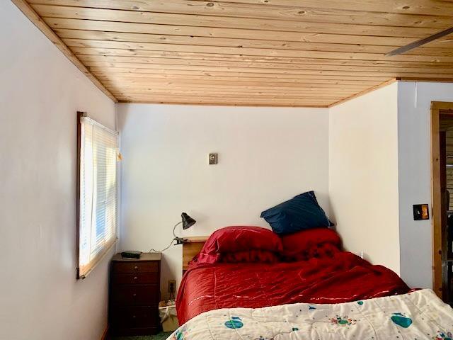 bedroom with wood ceiling