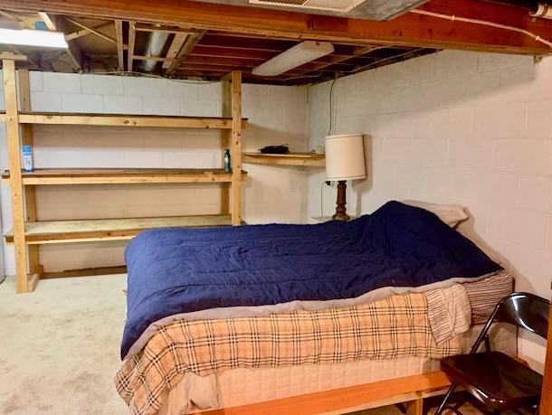 bedroom with concrete floors