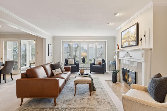 living room with a premium fireplace, crown molding, and light colored carpet