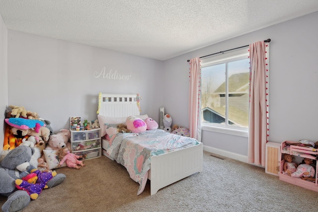 carpeted bedroom with a textured ceiling