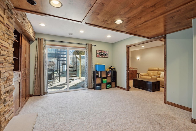 interior space featuring light carpet and wooden ceiling