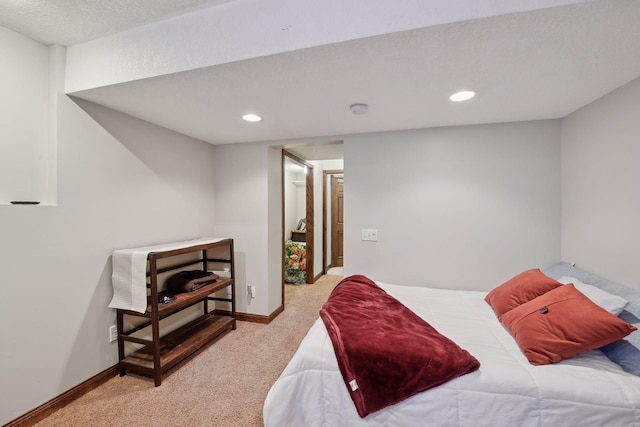 carpeted bedroom featuring a textured ceiling