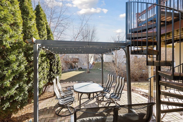 view of patio featuring a pergola