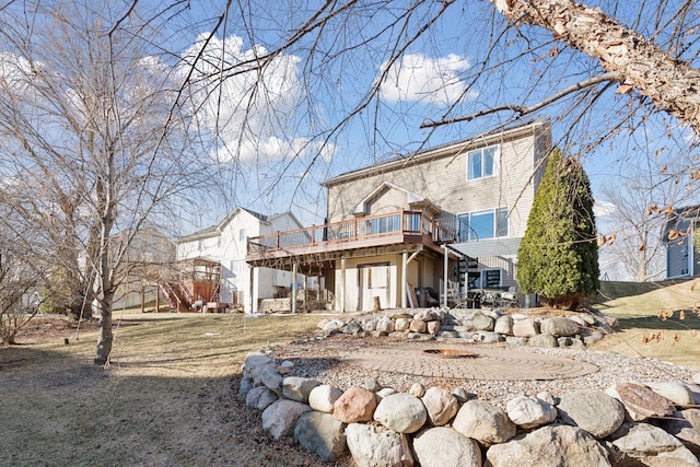 rear view of house featuring a wooden deck