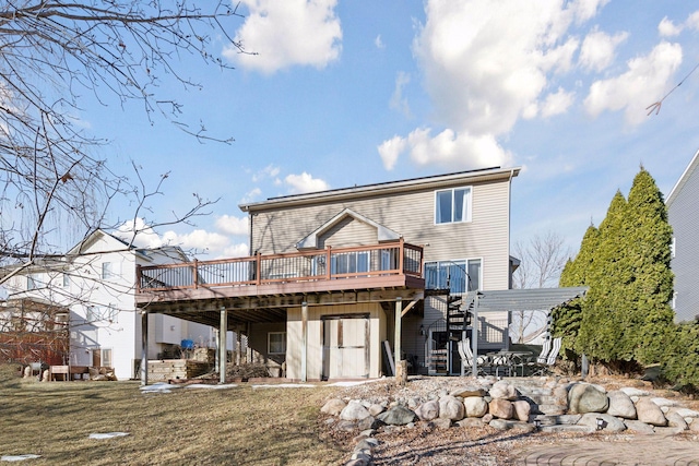 back of property featuring a wooden deck