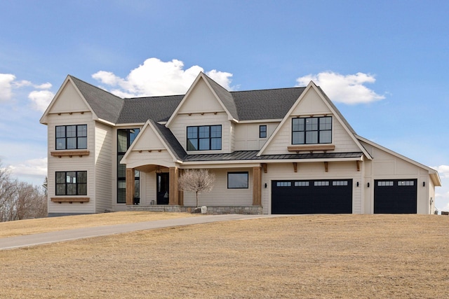 modern farmhouse featuring a garage