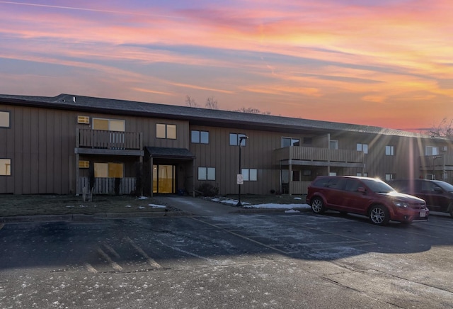 view of outdoor building at dusk