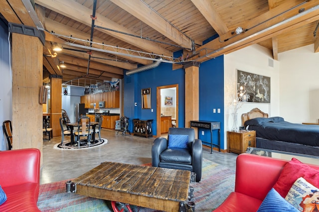 living room with concrete flooring, beam ceiling, and wooden ceiling