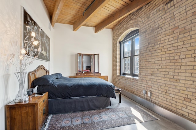 bedroom featuring beamed ceiling, wood ceiling, and brick wall