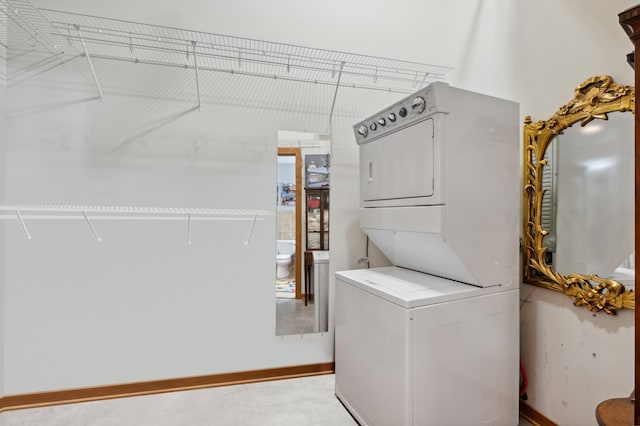 washroom with stacked washer and dryer