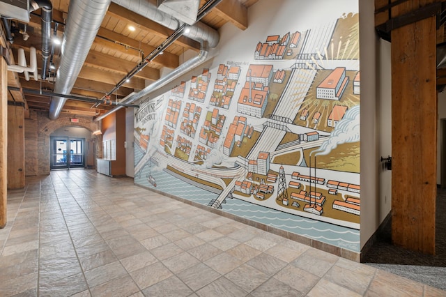 hall with beamed ceiling and wood ceiling