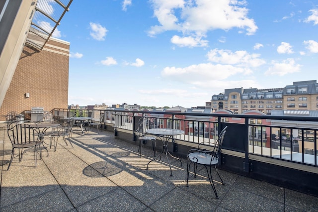 view of patio with a balcony and grilling area