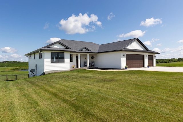 ranch-style house with a garage and a front lawn