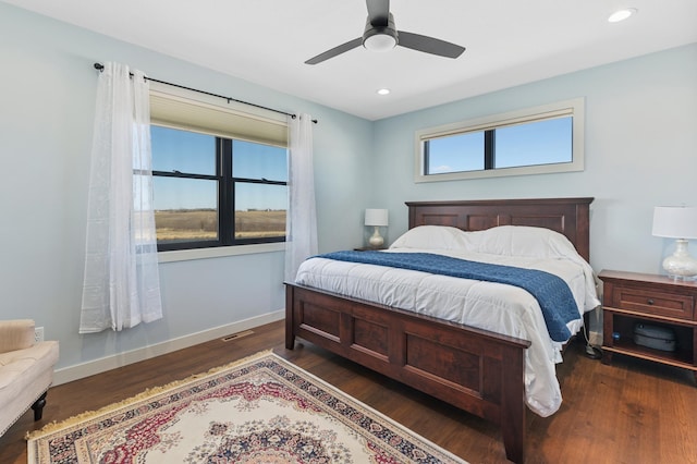 bedroom featuring dark hardwood / wood-style flooring and ceiling fan