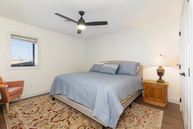 bedroom featuring ceiling fan and wood-type flooring