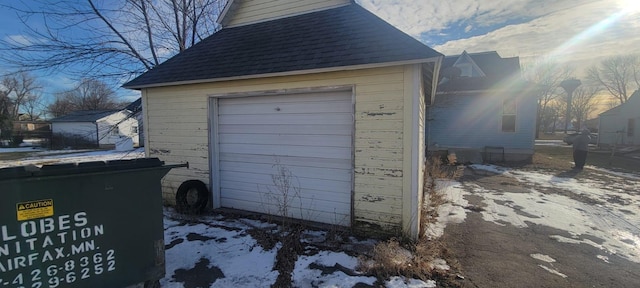 view of snow covered garage