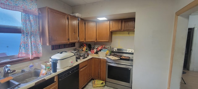 kitchen with stainless steel range with electric stovetop, sink, and black dishwasher