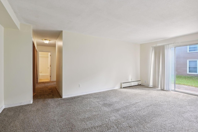 unfurnished room with carpet and a baseboard radiator