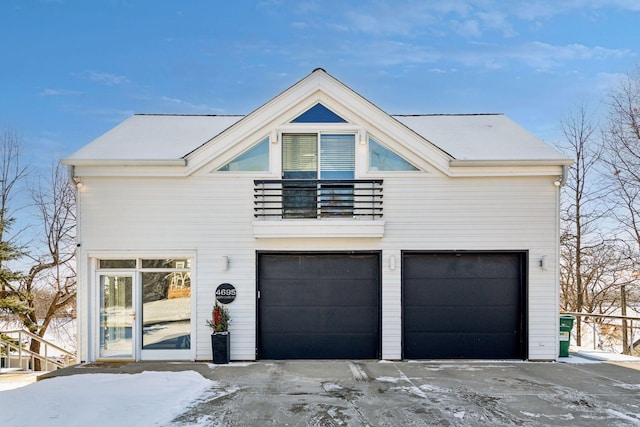 modern home featuring a balcony and a garage