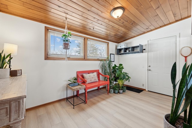 living area with light hardwood / wood-style flooring and wood ceiling