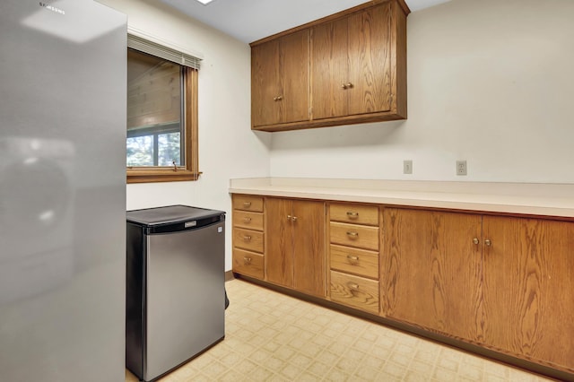 kitchen featuring stainless steel fridge