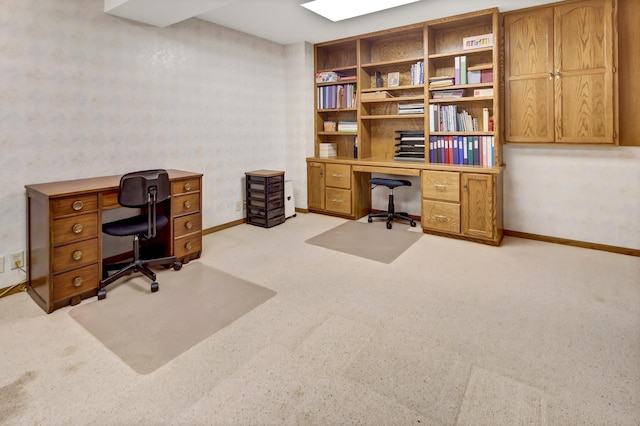 office area featuring light carpet