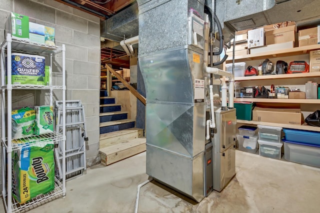 utility room featuring heating unit