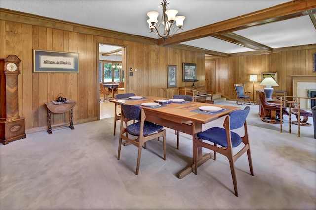 carpeted dining area featuring wood walls, beam ceiling, and a notable chandelier