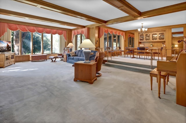 carpeted living room with beam ceiling and a chandelier