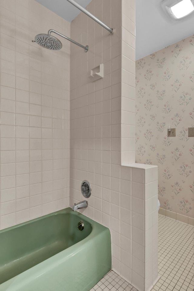 bathroom with tiled shower / bath and tile patterned floors