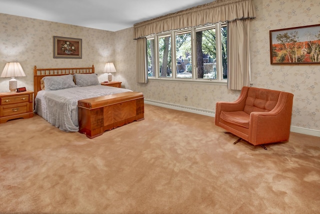 bedroom featuring baseboard heating and light colored carpet