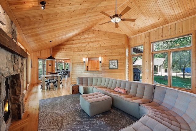 living room with ceiling fan, light hardwood / wood-style floors, wooden ceiling, and high vaulted ceiling