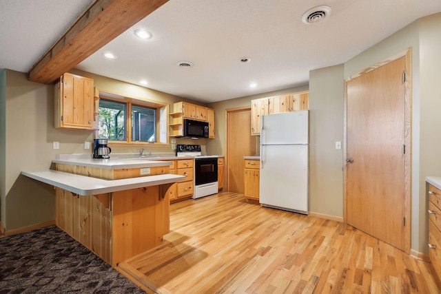 kitchen with light brown cabinets, white appliances, beam ceiling, kitchen peninsula, and a breakfast bar area