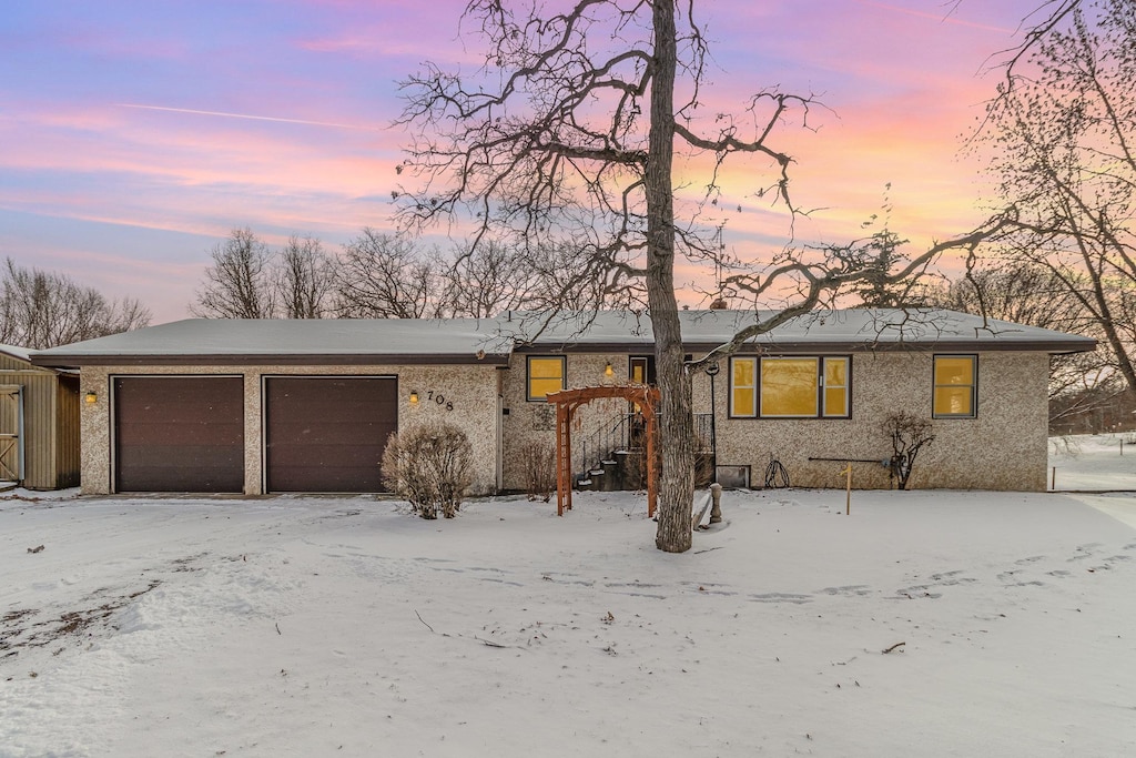 ranch-style house featuring a garage