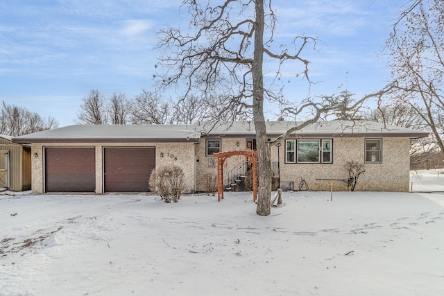 single story home featuring a garage