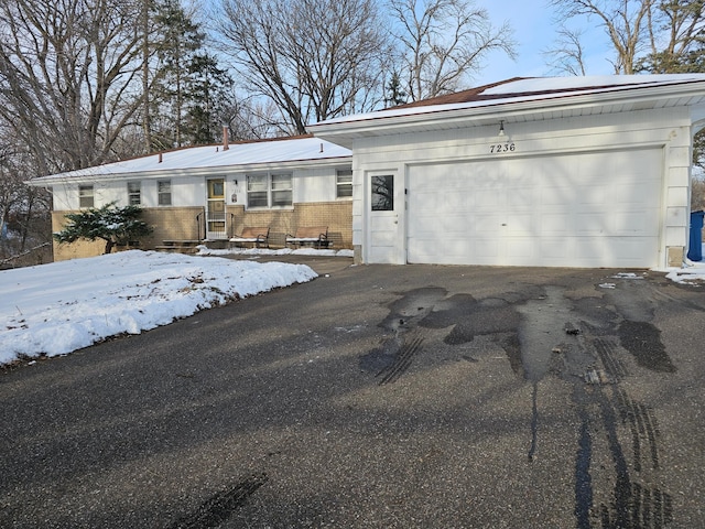 single story home featuring a garage